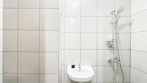 Standard Apartment | Bathroom | Shower - White Studio Room (No Kitchen) At Bandaraya - Tallasa City Makassar Apartment (Makassar)