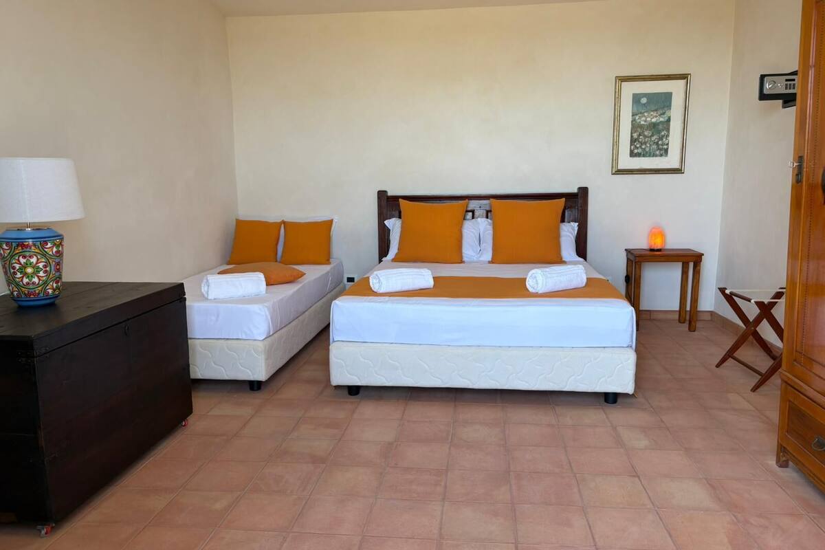 Deluxe Triple Room, Garden View | Laptop workspace, soundproofing, free WiFi