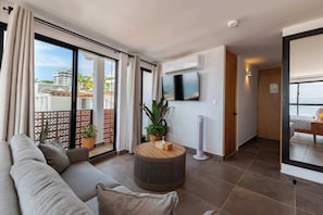 Exclusive Suite, Balcony, Ocean View | Living area | 50-inch LED TV with digital channels