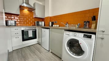 Family Apartment | Private kitchen | Fridge, microwave, oven, stovetop