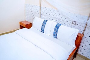 1 bedroom, bed sheets - Small Double Room -Deluxe Double Room with Balcony (Gisenyi)