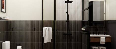 Une salle de bain moderne équipée d’une douche, de toilettes et d’un lavabo.