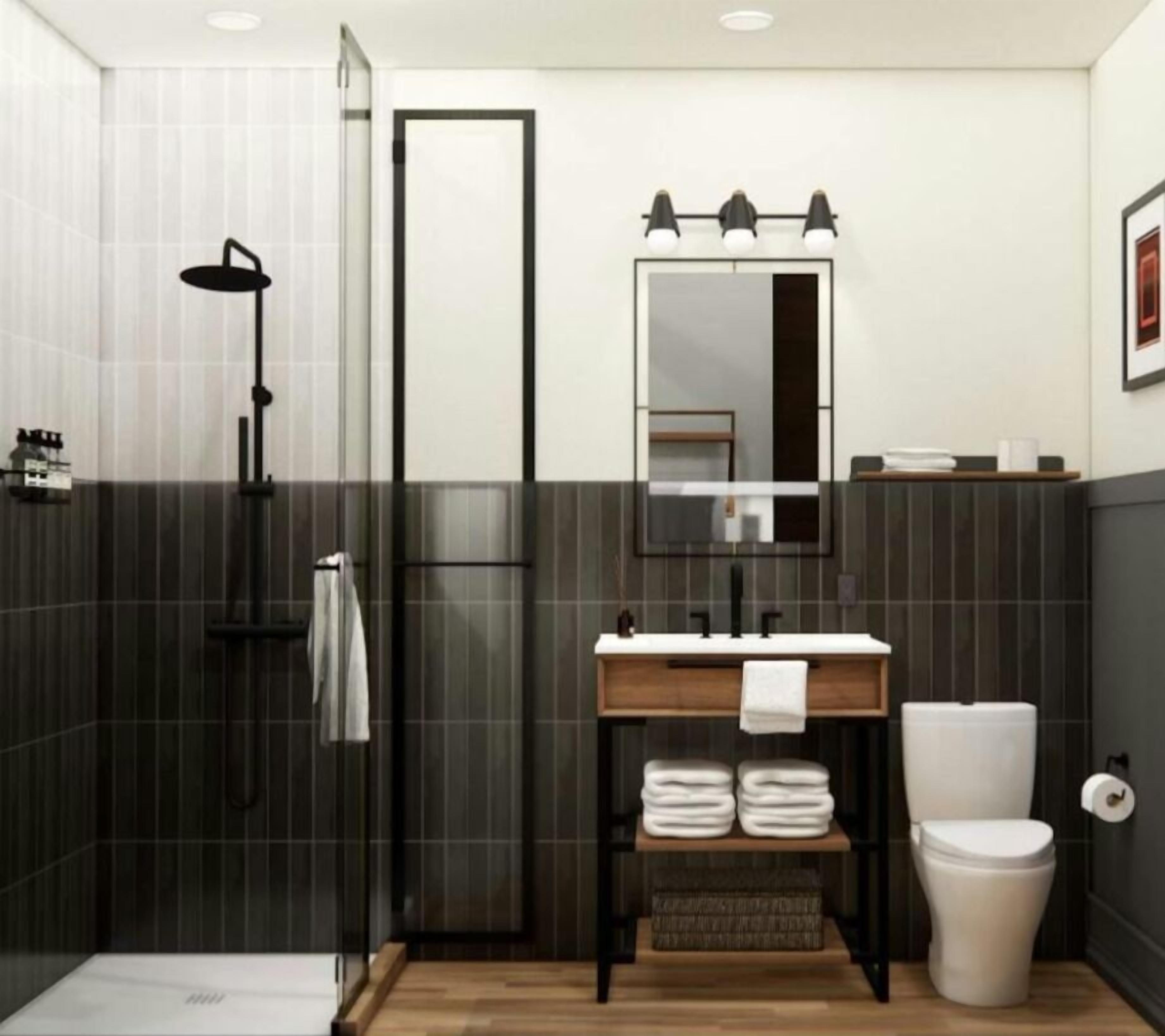 A modern bathroom with a glass shower enclosure, a wooden vanity with a mirror, and a toilet.