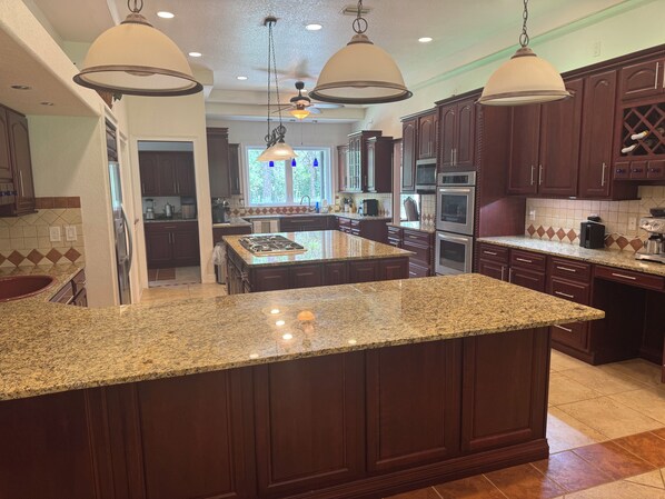 Fridge, microwave, oven, stovetop - Escape to this serene 4-bedroom home set on 10 private acres. (Wildwood)