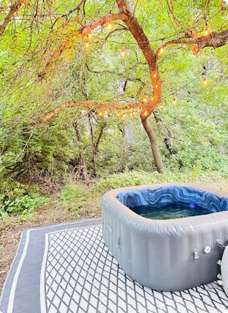 Outdoor spa tub. Skoolie Stay on small Ranch w/ seasonal private Hot Tub