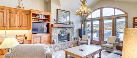 TV, fireplace, books