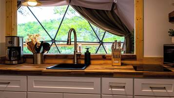 Fridge, microwave, coffee/tea maker, cookware/dishes/utensils