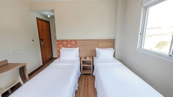 Economy Twin Room, City View | In-room dining