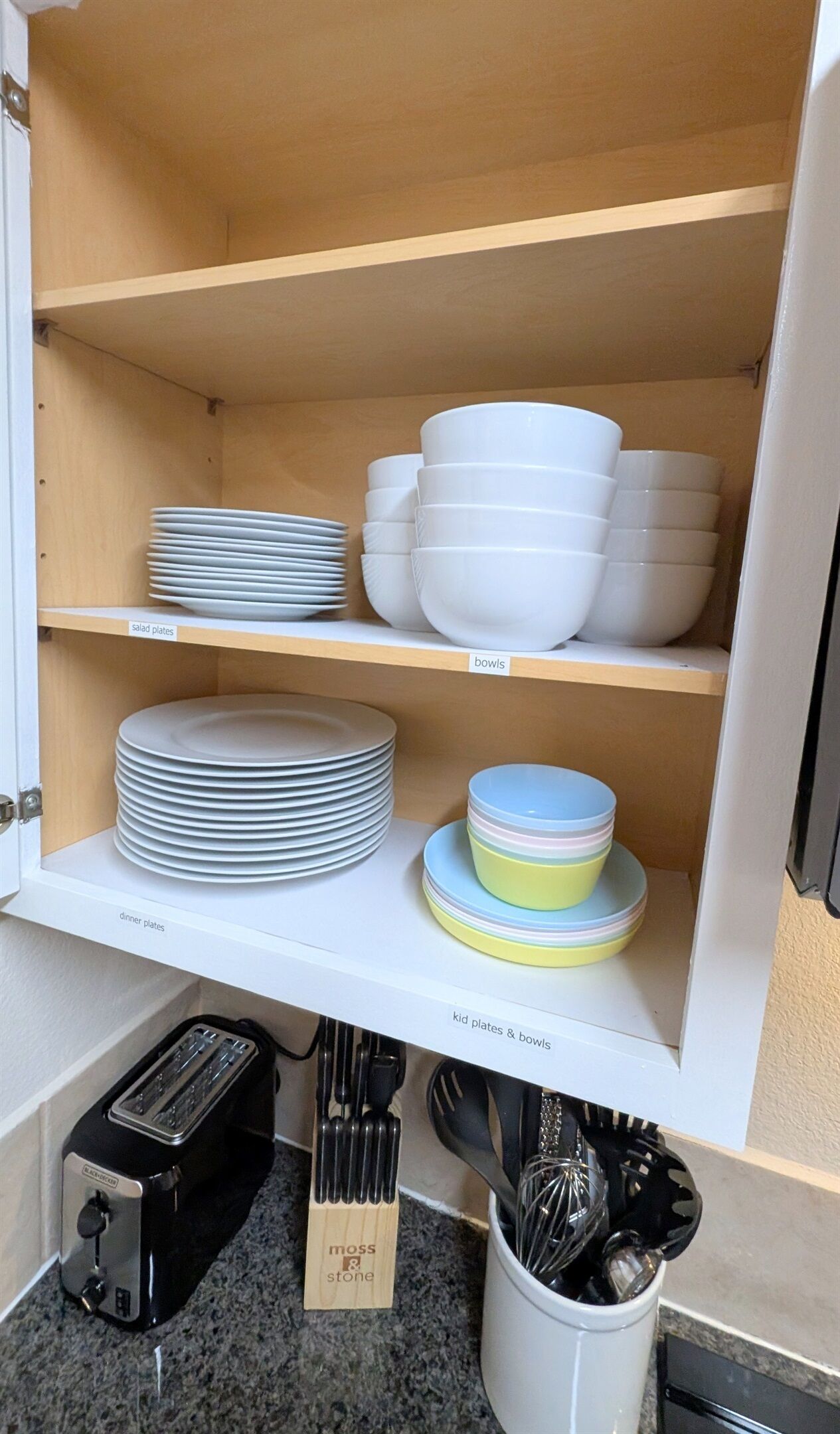 Plenty of dinner plates, salad plates, bowls, and kid-friendly plates and cups for all guests to use. 