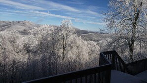 A snowy landscape with a wooden staircase leading up to a viewing platform. - 1-Bedroom Condo w/ Fireplace in Sugar Mountain (Sugar Mountain)