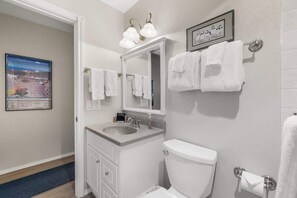 Shower, hair dryer, towels, shampoo