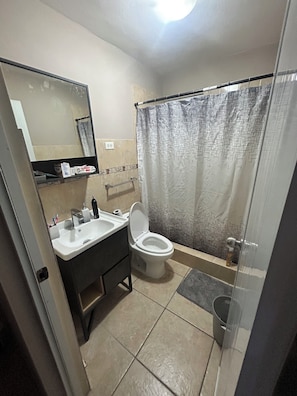 Shower, towels, soap, toilet paper