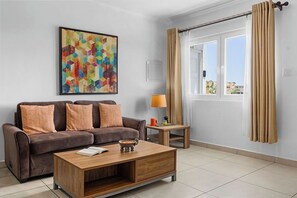 Cozy up on the leather sofa, stream on the 55" Smart TV, or gather with loved ones in this open-concept living space—perfect for relaxing or entertaining.
