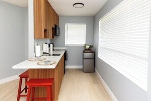 Fridge, microwave, stovetop, coffee/tea maker