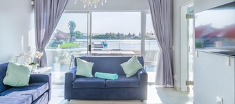 Luxury Riverside Getaway | Balcony | Pool