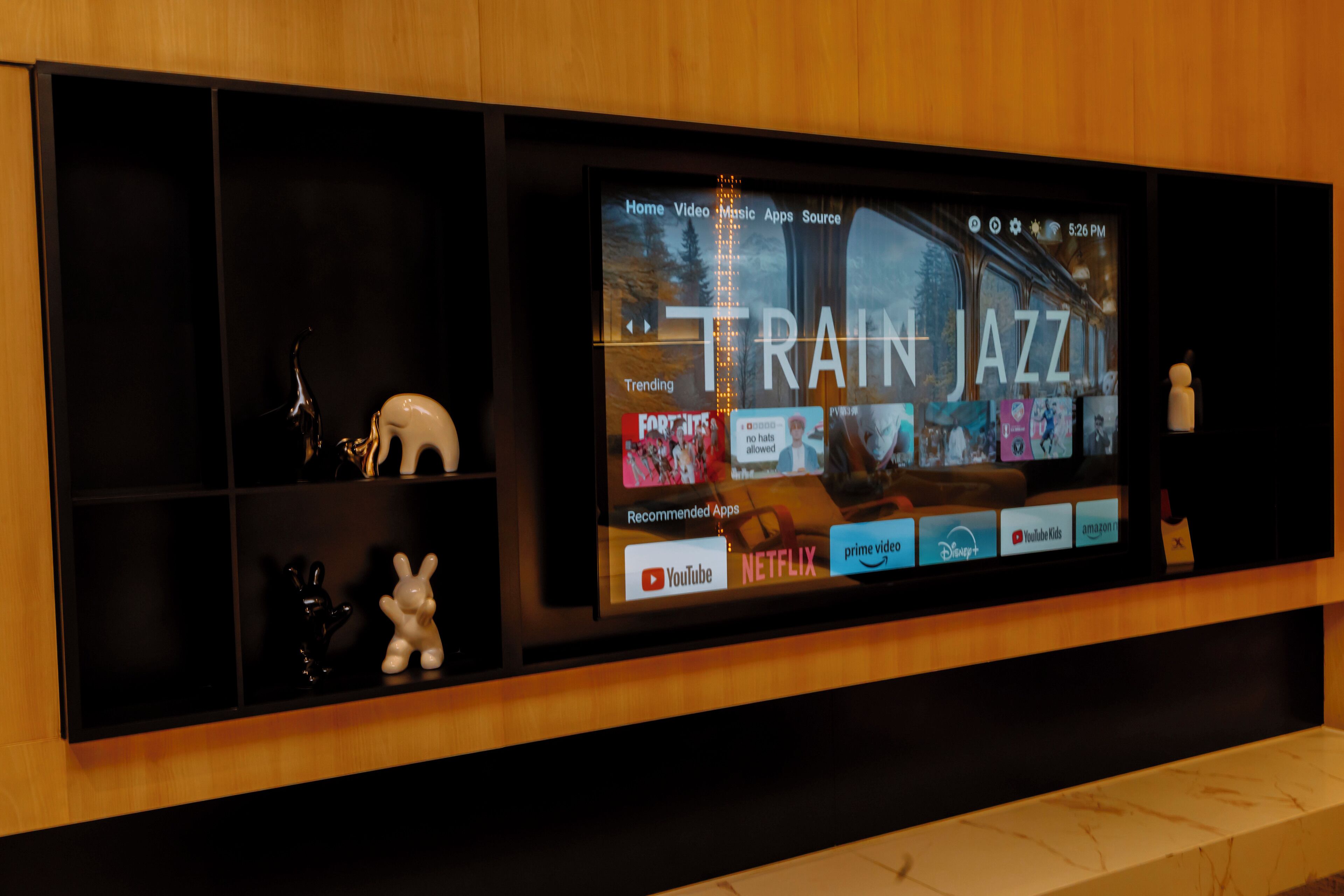 A television screen displaying a streaming service interface with "TRAIN JAZZ" prominently featured.