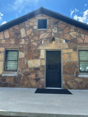 Exterior detail - Modern stone cottage just one minute from I-40 exit 321 in Muldrow, Oklahoma. (Muldrow)