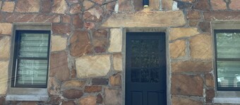 Modern stone cottage just one minute from I-40 exit 321 in Muldrow, Oklahoma.