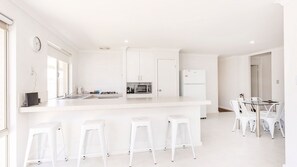 Microwave, oven, toaster, dining tables