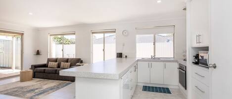 Microwave, oven, toaster, dining tables