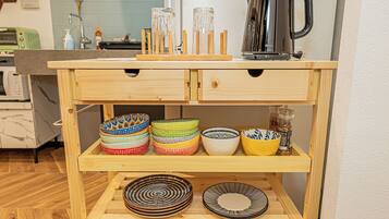 Fridge, microwave, stovetop, cookware/dishes/utensils