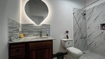 Shower, towels, soap, toilet paper