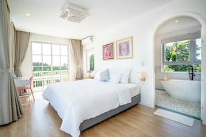 Deluxe Room, Balcony, Garden View | Desk, free WiFi