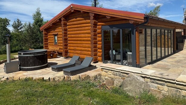 A log cabin with a glass extension, outdoor seating, and a hot tub. - Grand Country Estate 3 Hot Tubs Sleeps 16 near Durham City & Bishop Auckland (Oakenshaw)