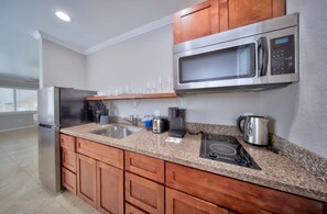 Fridge, microwave, stovetop, coffee/tea maker