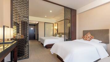 Four Seasons Family Twin Room | Down comforters, in-room safe, laptop workspace, iron/ironing board