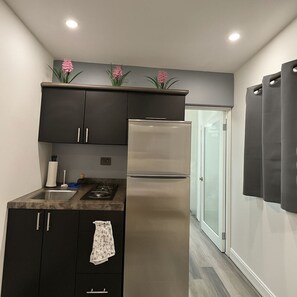 Fridge, microwave, stovetop, dining tables