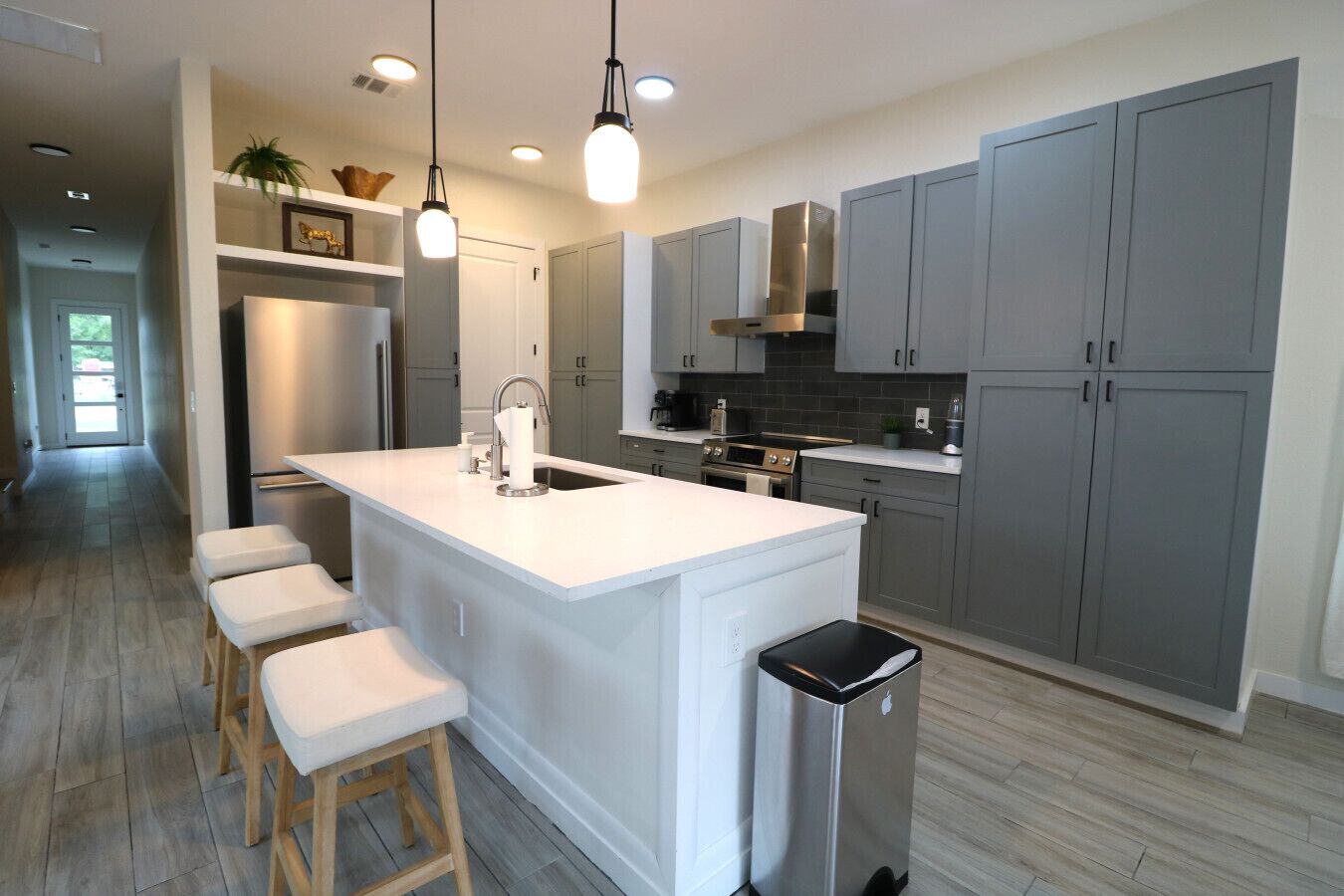 Fridge, stovetop, dishwasher, coffee/tea maker