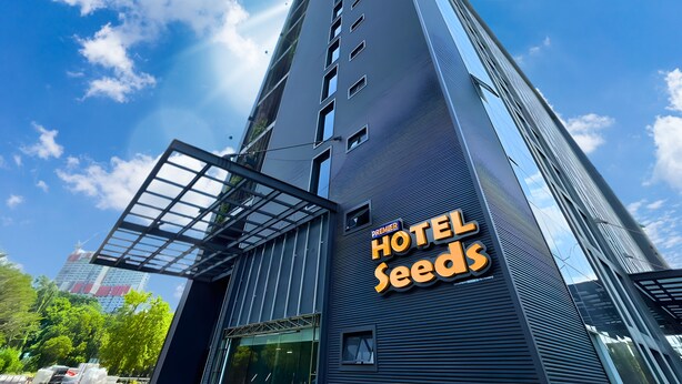A modern hotel building with a prominent sign reading 'Hotel Seeds.' - Seeds Hotel Premier One City Subang (Subang Jaya)