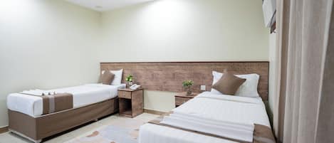 Twin Room | Minibar, blackout drapes, iron/ironing board, free WiFi
