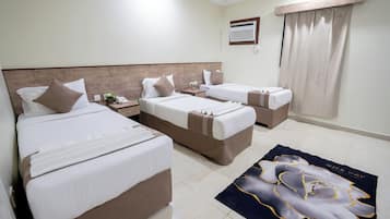 Triple Room | Minibar, blackout drapes, iron/ironing board, free WiFi