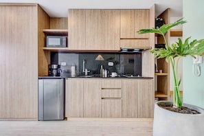 Fridge, microwave, stovetop, coffee/tea maker