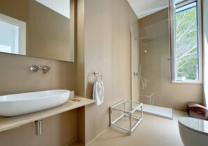 A modern bathroom with a large white sink, a glass shower enclosure, and a view of greenery outside. - Solemar Sicilia - Villa Regina Elena (Palermo)
