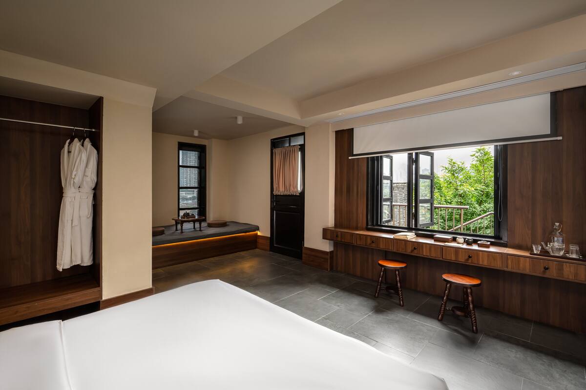 Elite Double Room, Patio, City View | Blackout drapes, iron/ironing board, free WiFi
