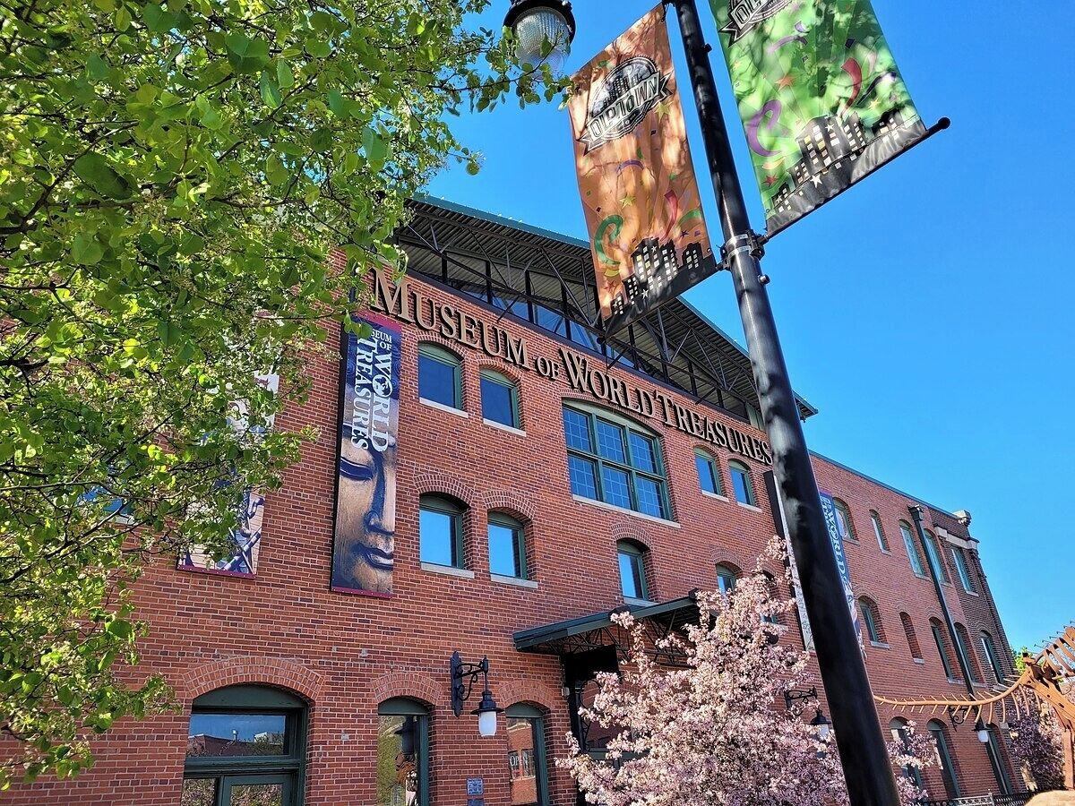 A brick building with a sign reading "Museum of World Treasures."