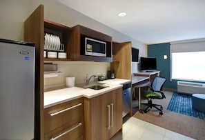Fridge, microwave, coffee/tea maker, cookware/dishes/utensils