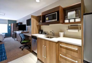 Fridge, microwave, coffee/tea maker, cookware/dishes/utensils