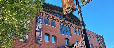 A brick building with a sign reading "Museum of World Treasures."