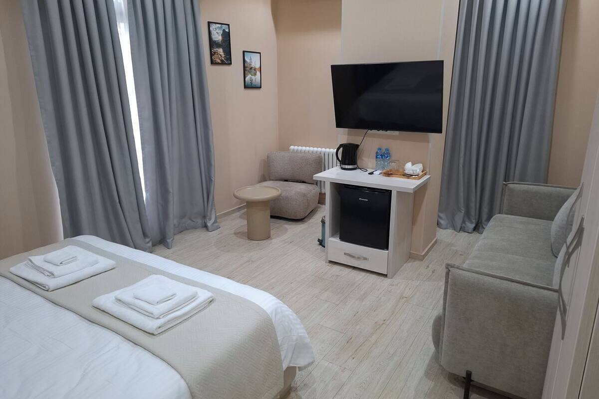 Deluxe Double Room, Balcony, City View | Iron/ironing board, free WiFi, bed sheets