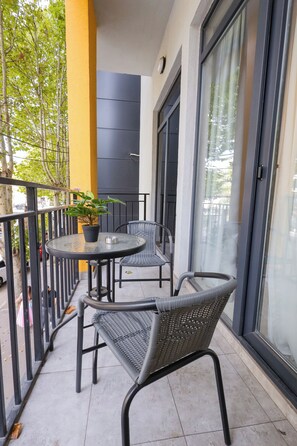 Deluxe Double Room, Balcony, City View | Iron/ironing board, free WiFi, bed sheets