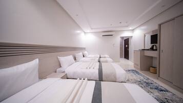 Quadruple room | Minibar, iron/ironing board, free WiFi, bed sheets