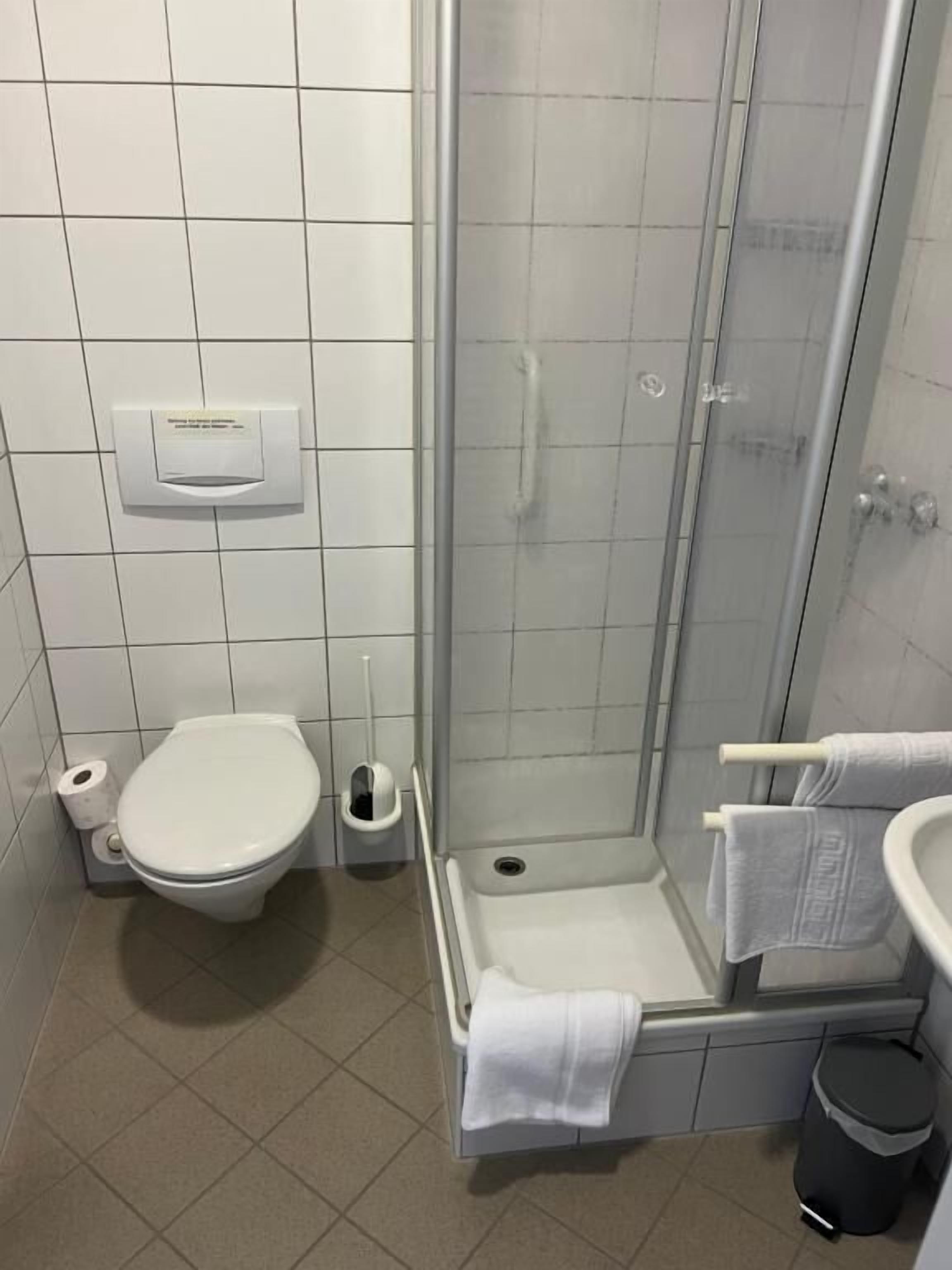 Shower, free toiletries, towels, toilet paper