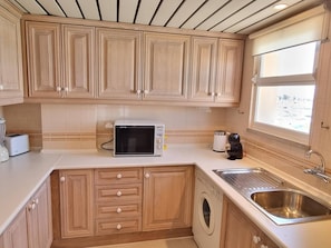 Fridge, microwave, coffee/tea maker, toaster