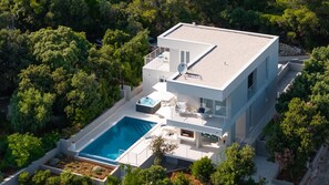 A modern two-story house with a swimming pool, a hot tub, and a balcony. - VILLA MON AMOUR by Villas Guide (Blato)