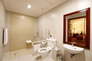 Shower, towels, soap, toilet paper