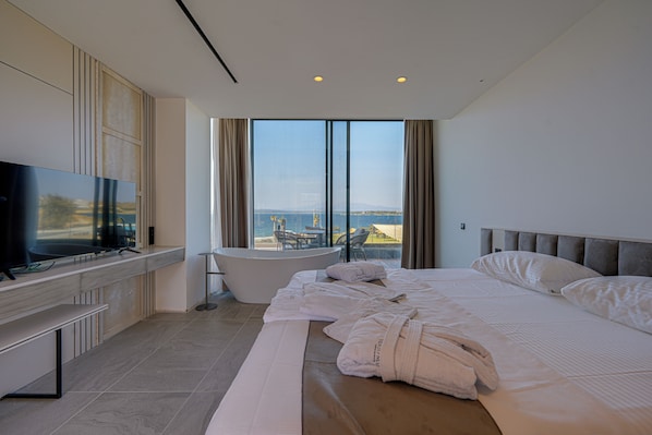 Luxury Studio Suite, 1 King Bed, Private Bathroom, Sea View | Desk, laptop workspace, free WiFi